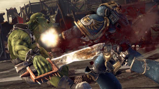 A space marine punches an orc.