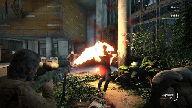 Joel attacks an enemy with a flamethrower.