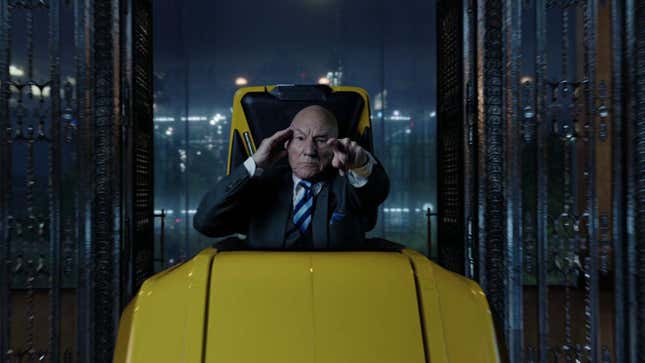 Professor X sits in his wheelchair and points at something off-screen.