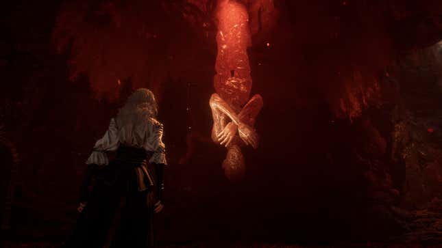 Maelle approaches a sap lady hanging from the roof of a cave.