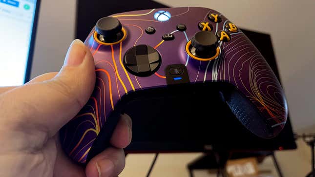 A photo of a Scuf Instinct Pro controller with a lovely purple faceplate.