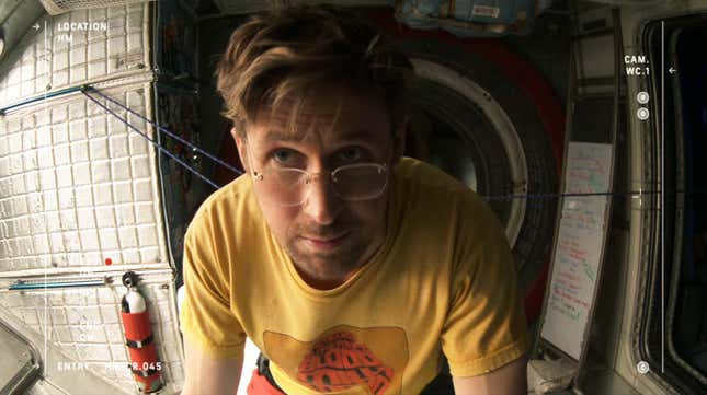 Ryan Goslin wearing a yellow t-shirt and glasses.
