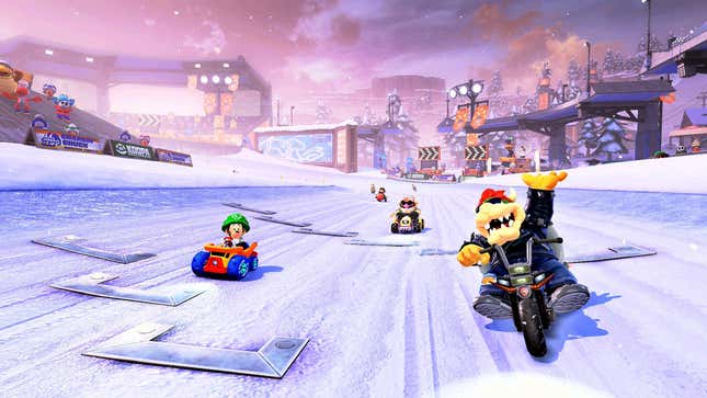 Bowser drives along Baby Luigi, Wario, and other racers.